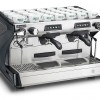 This image is a front-side view of the Rancilio Classe 5 2 group espresso machine in Anthracite Black, with tall/raised brew group height and USB volumetric dosing controls.